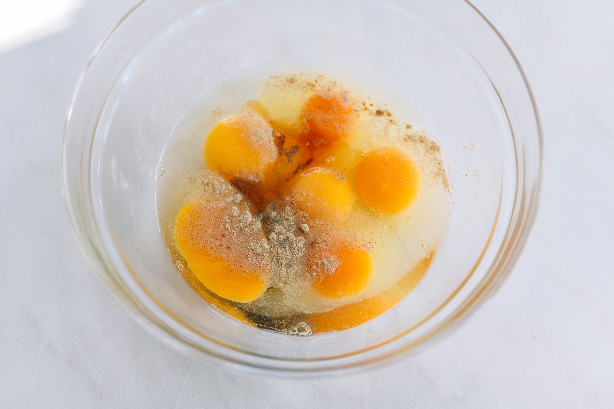 eggs in bowl with seasonings