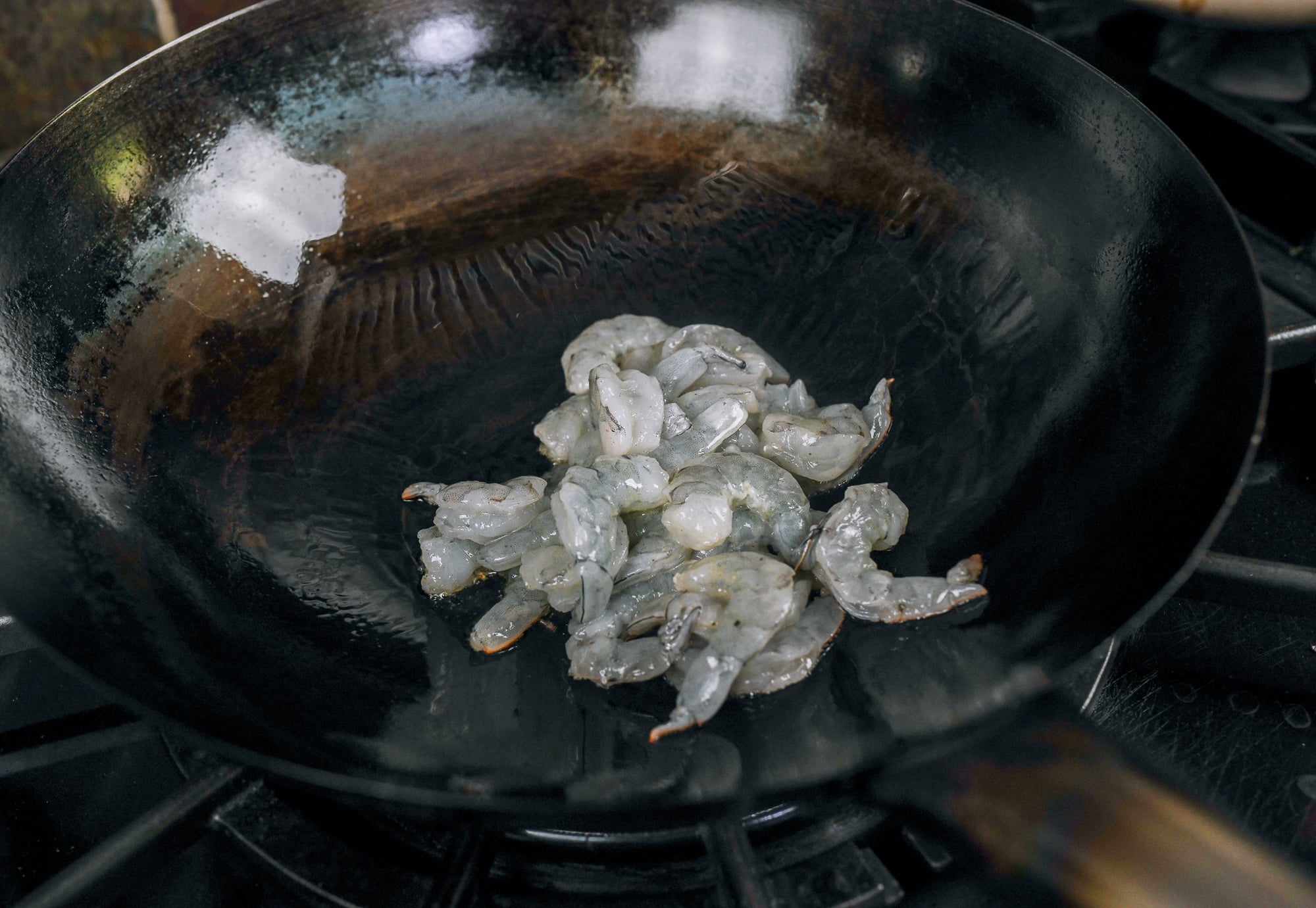 peeled deveined shrimp in wok
