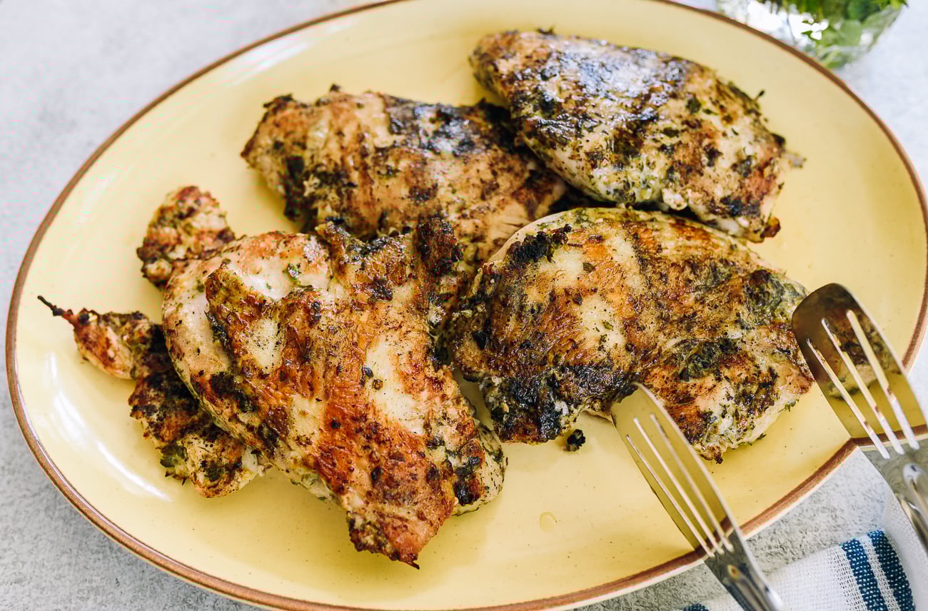plate of grilled chicken breasts