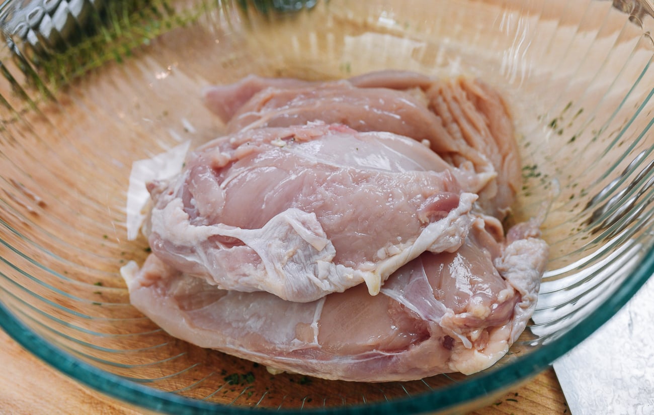 de-boned chicken breasts in glass bowl