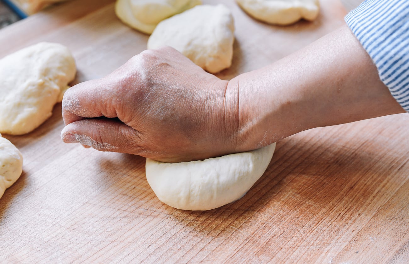 kneading dough ball with heel of hand