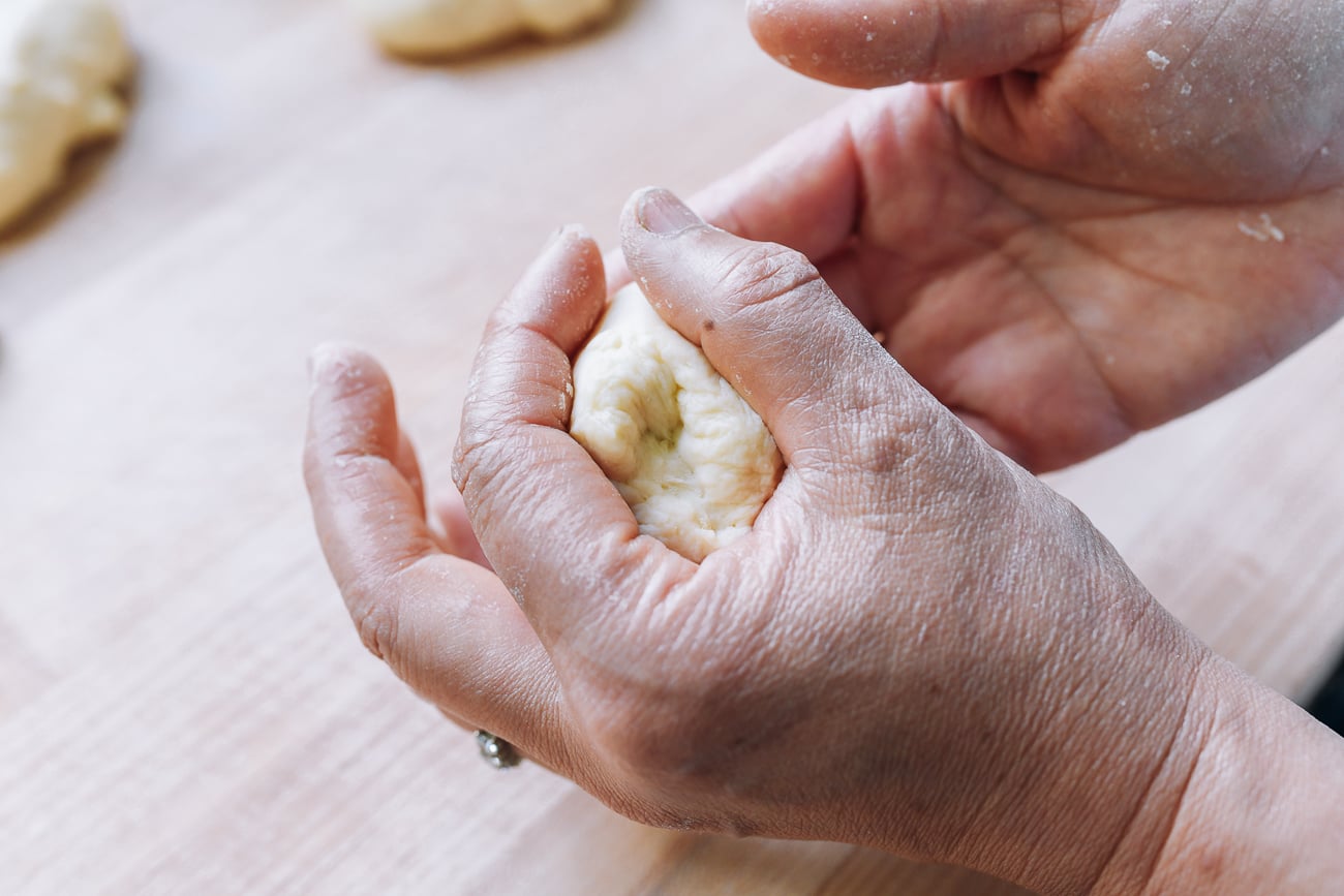 shaping dough into a ball