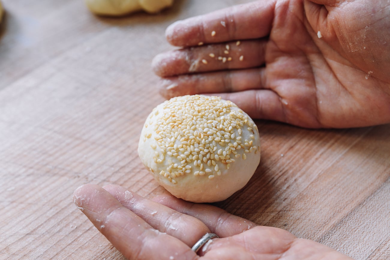 dough ball coated in sesame seeds