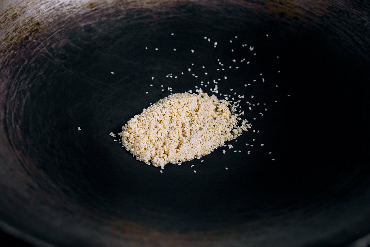 rinsed sesame seeds in wok