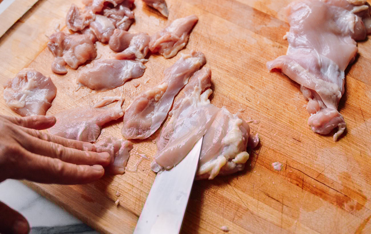 slicing boneless skinless chicken thighs