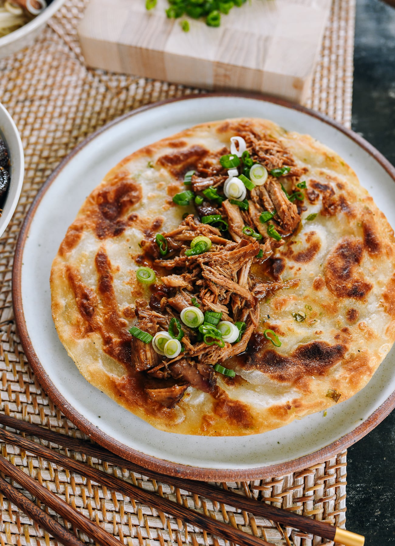 red braised pulled pork on a scallion pancake
