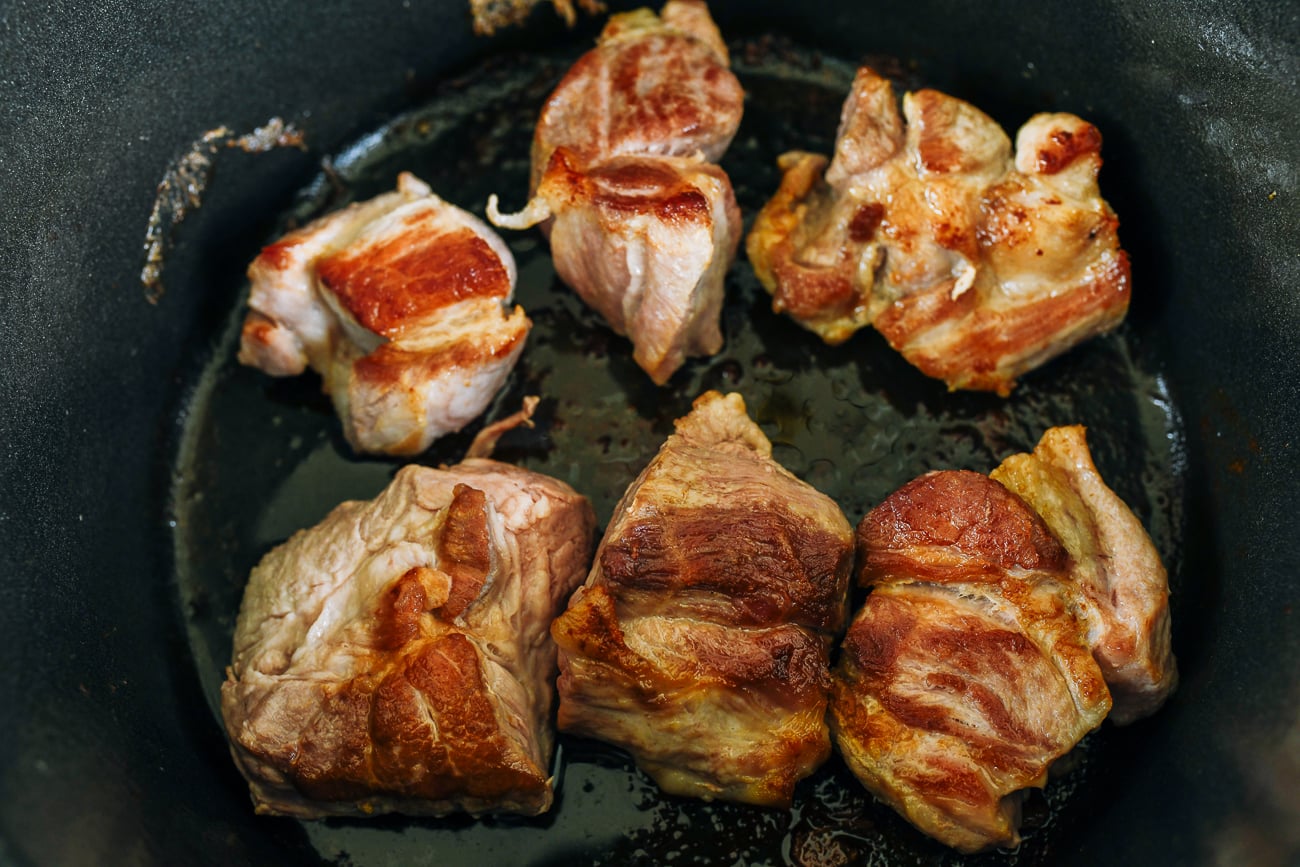 Browning large pork pieces in dutch oven