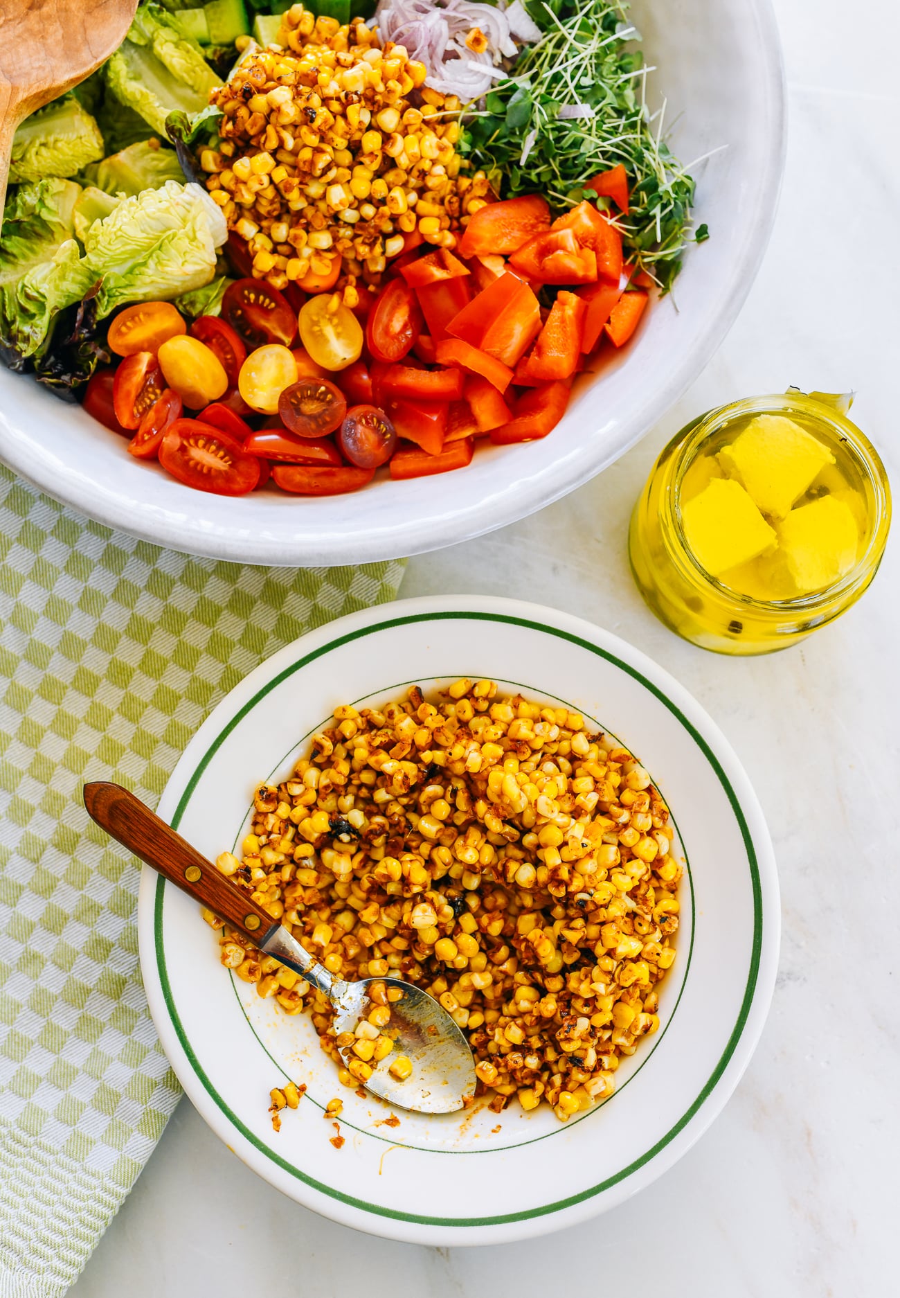Serving fried corn with summer salad