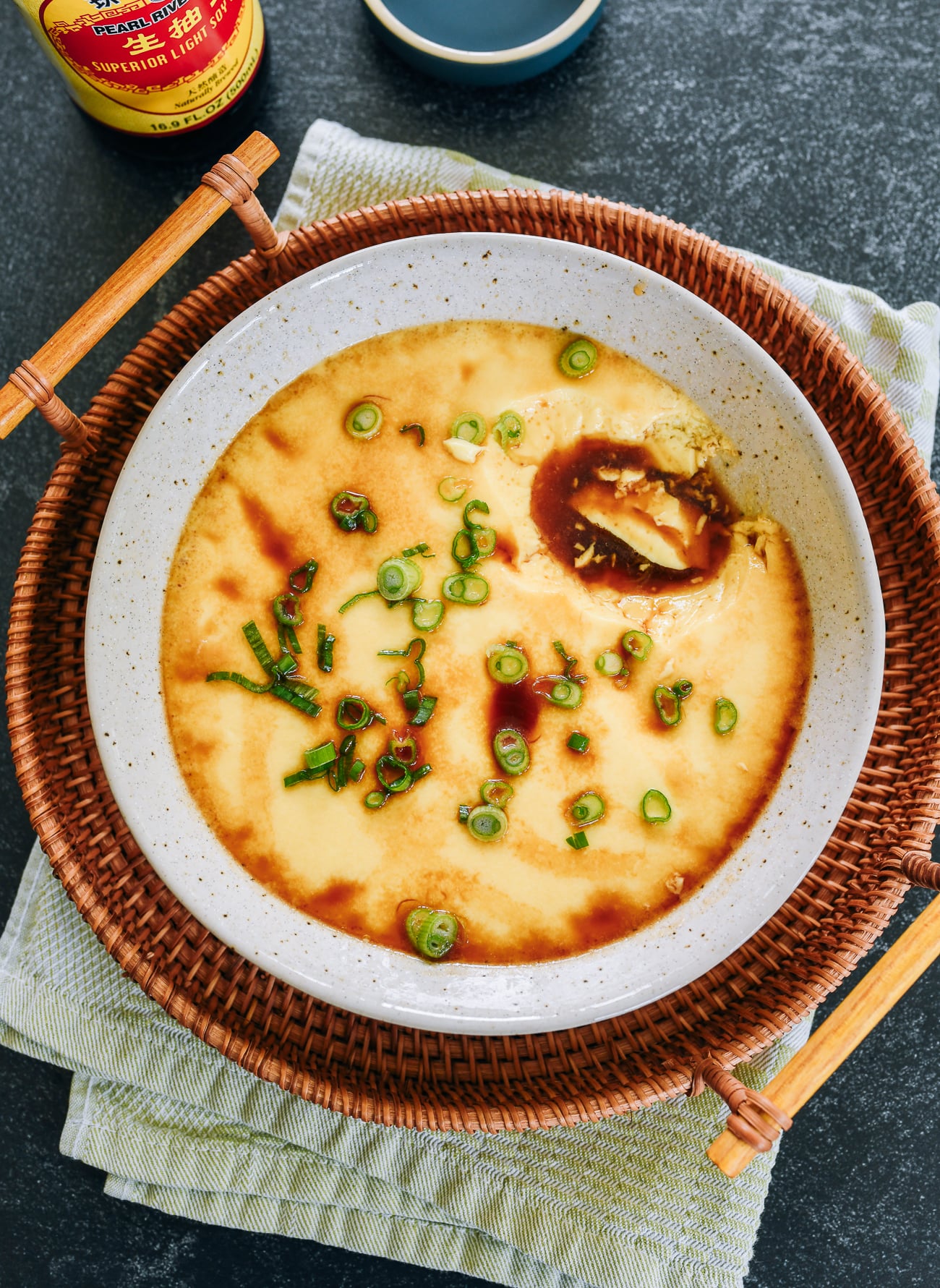 Chinese steamed egg with light soy sauce on top
