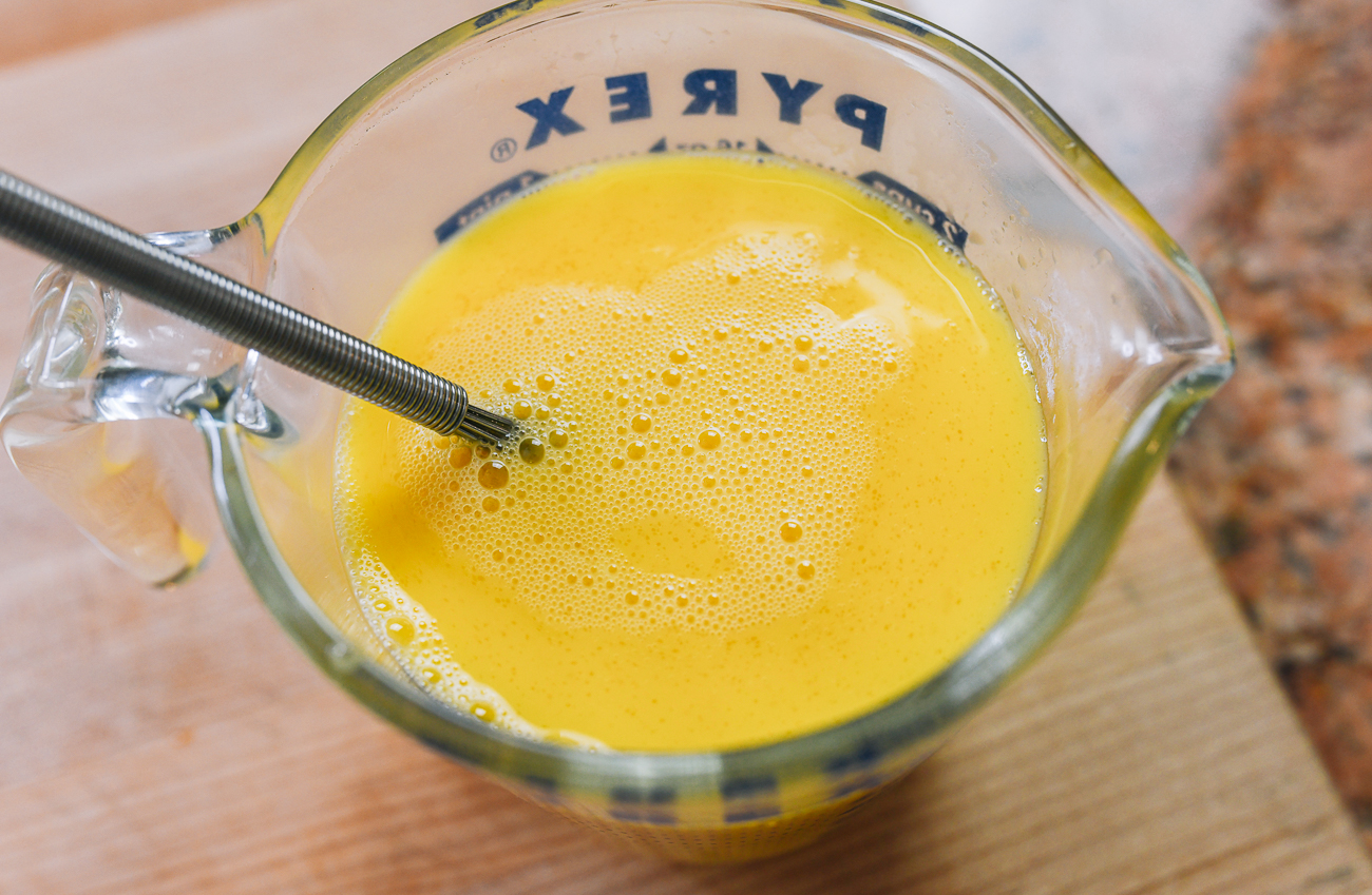 beating eggs in measuring cup