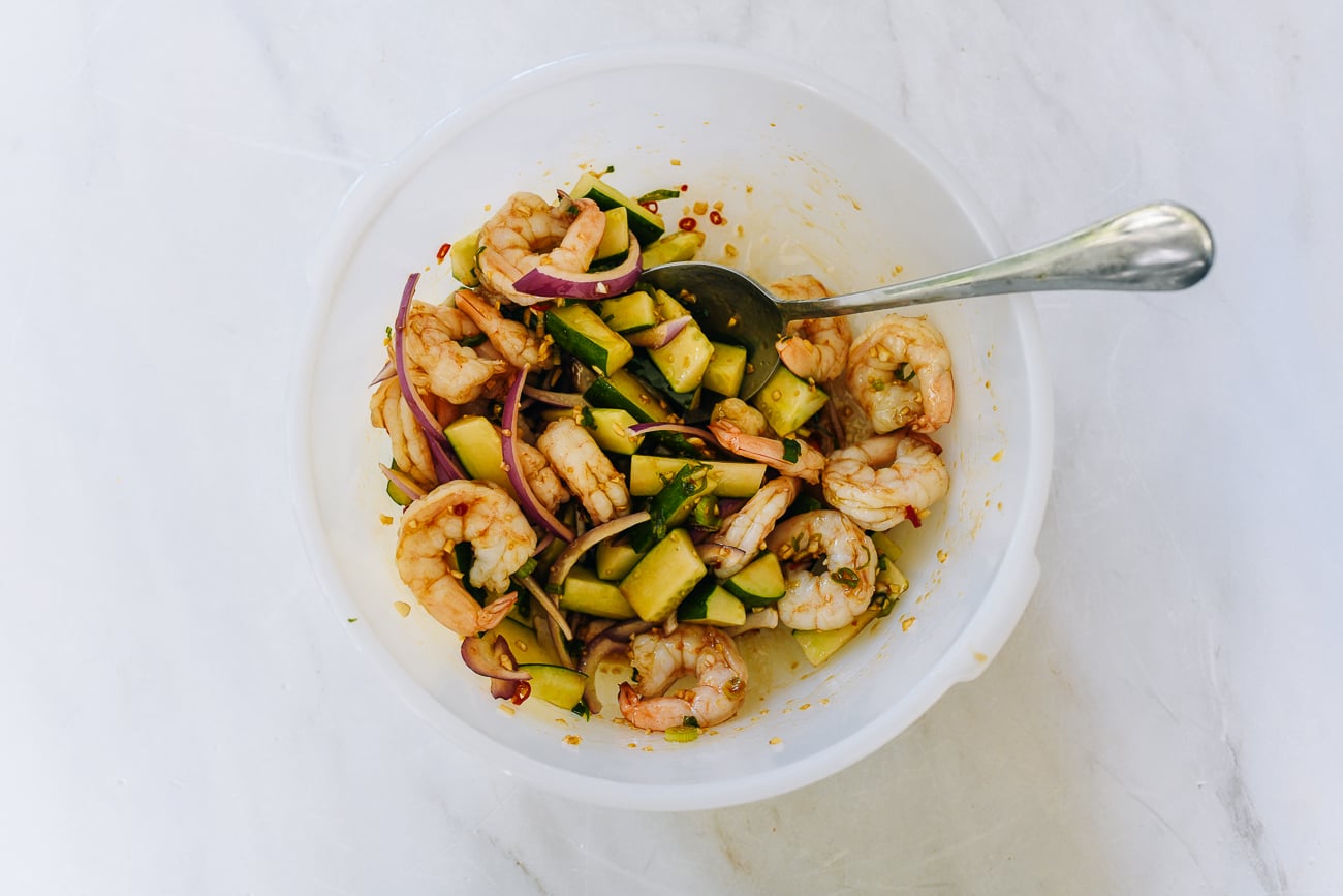 Mixing Asian-style shrimp salad