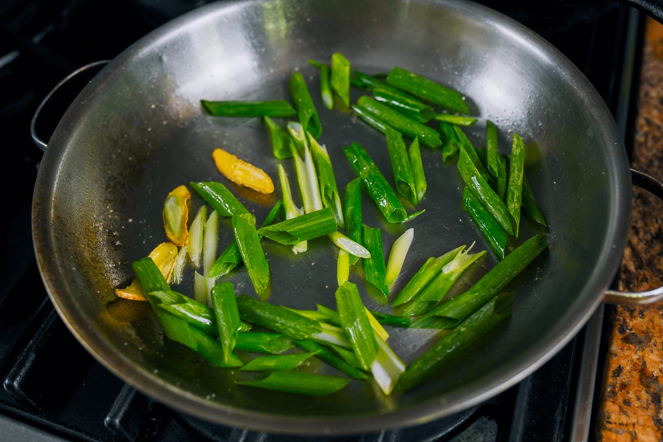 scallions added to pan with ginger