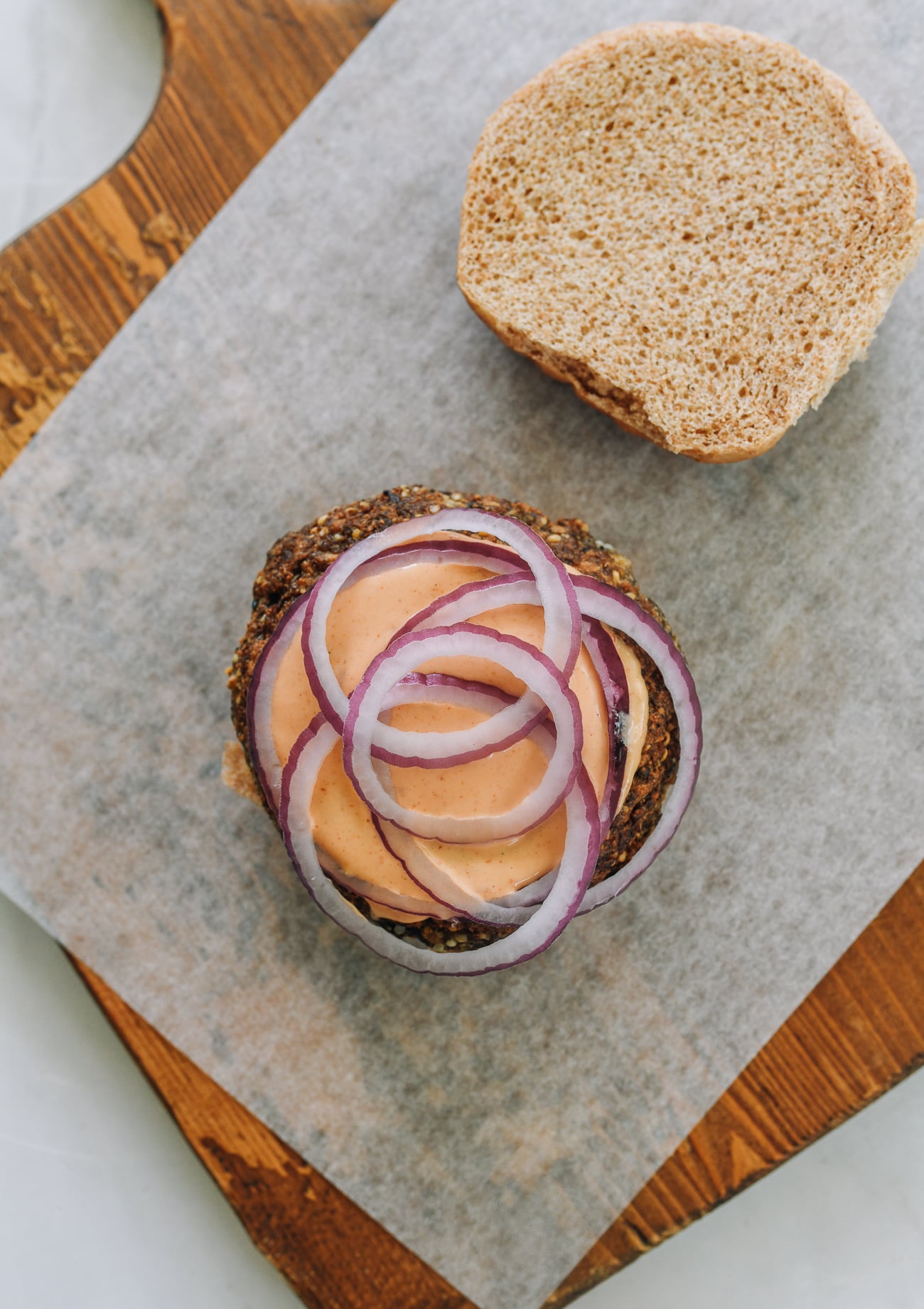 burger with sauce and red onion