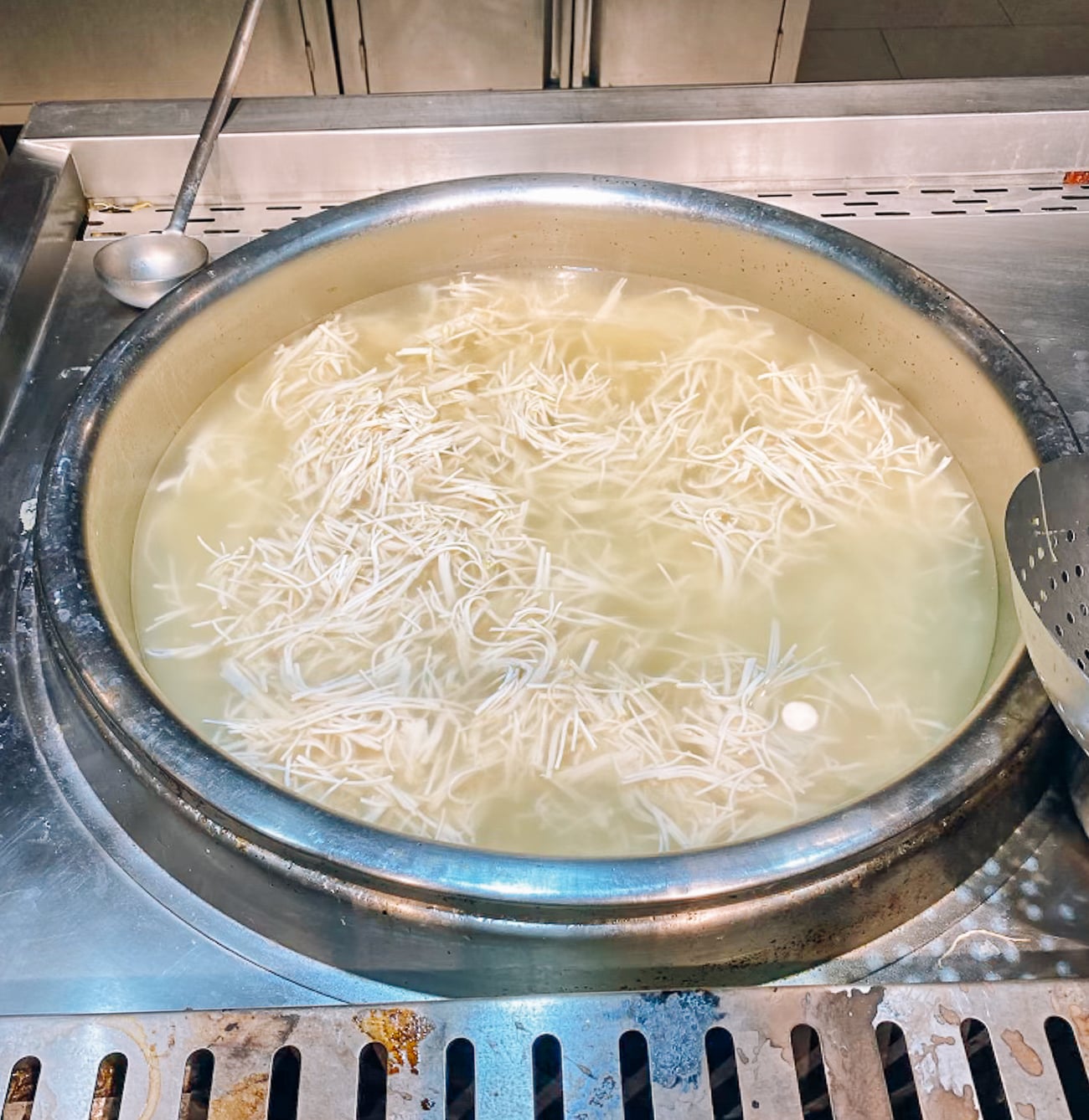 tofu shreds in pot of broth