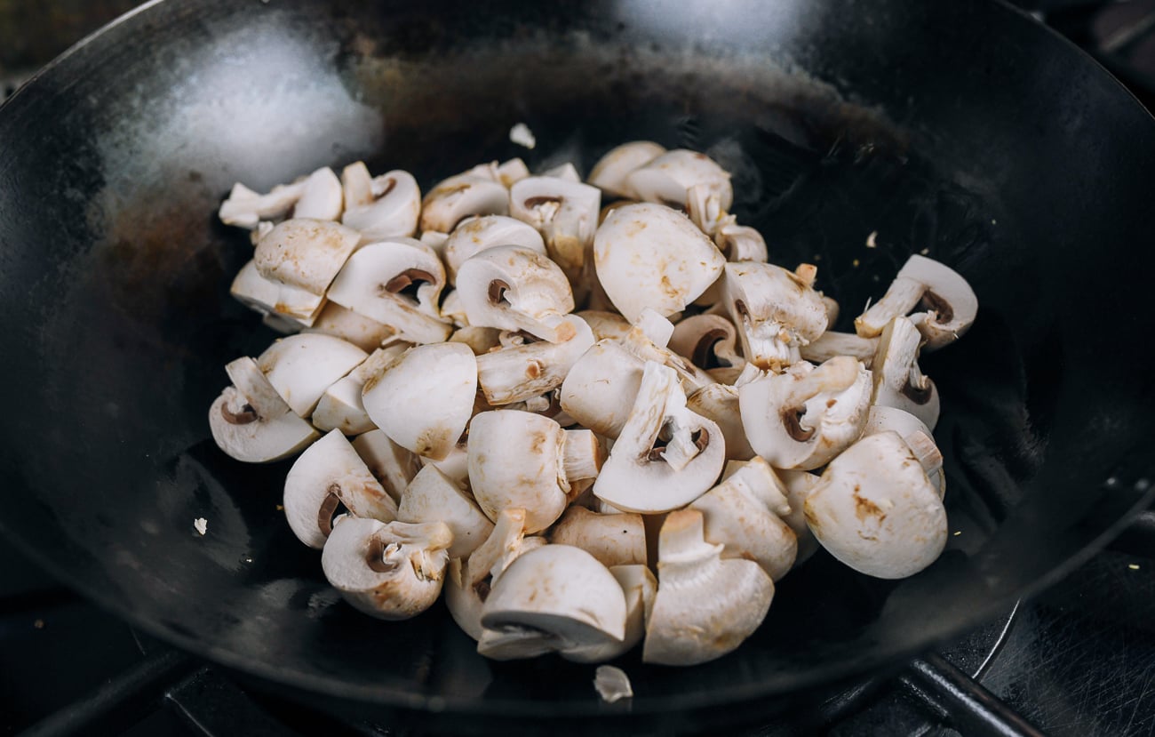 mushrooms added to wok