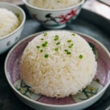 Mound of chicken flavored rice with scallions on top