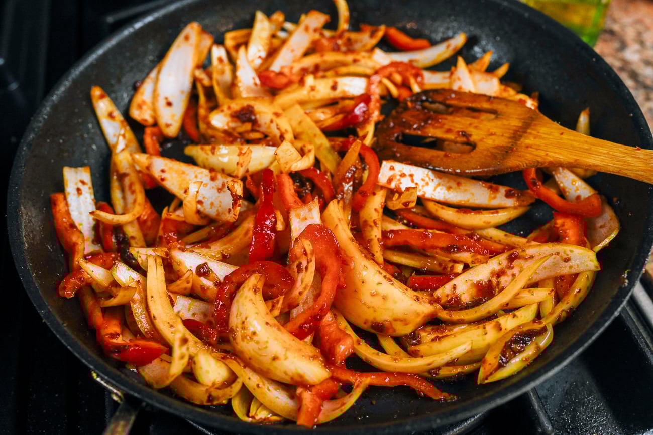 onions and peppers in red curry paste