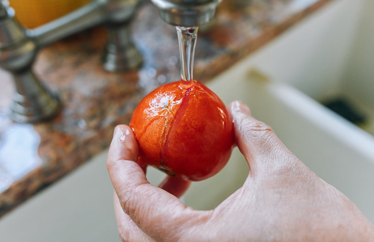 tomato skin cracking on frozen tomato rinsed in running water
