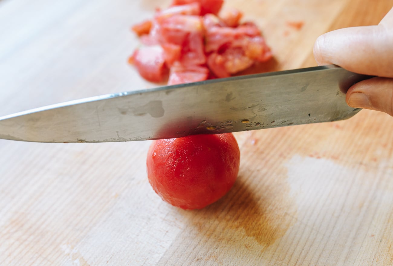 cutting frozen tomato