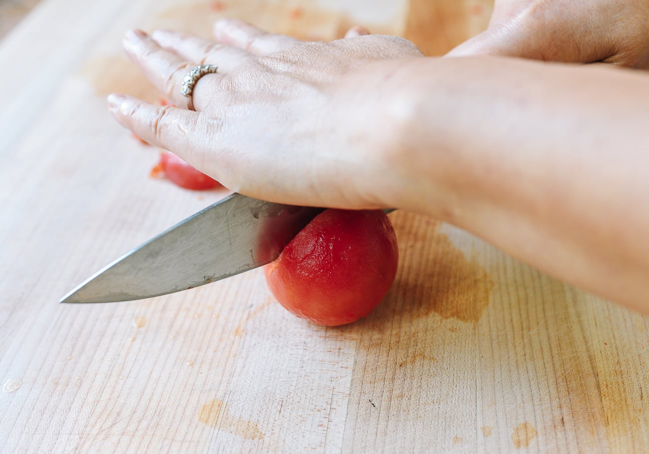 cutting frozen tomato with a knife