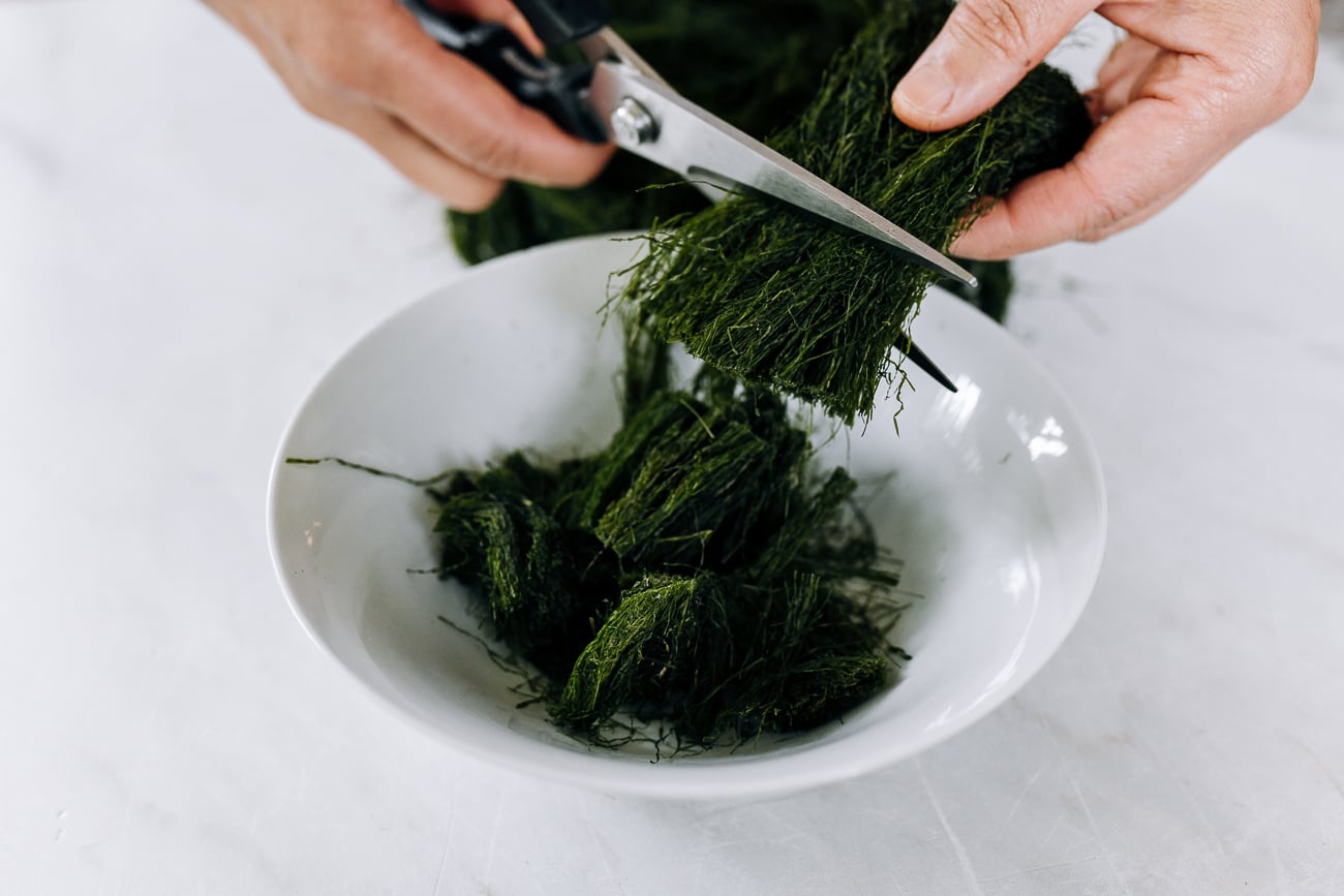 cutting dried sea moss into short pieces