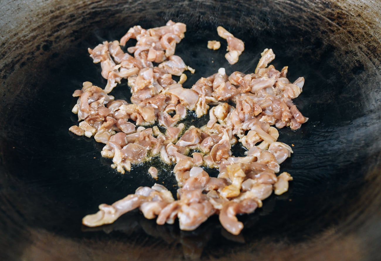 searing chicken in wok