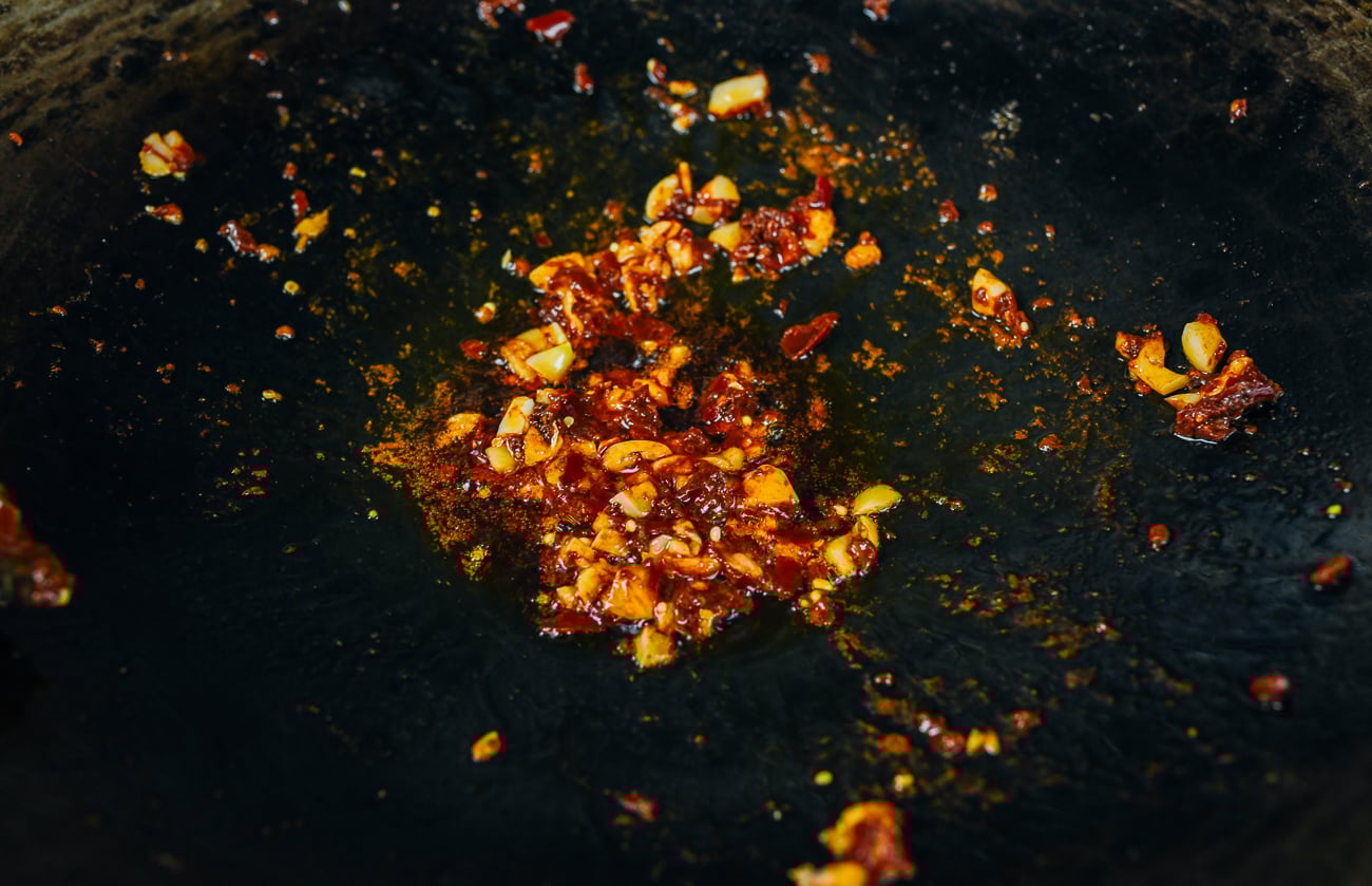 garlic added to spicy bean sauce