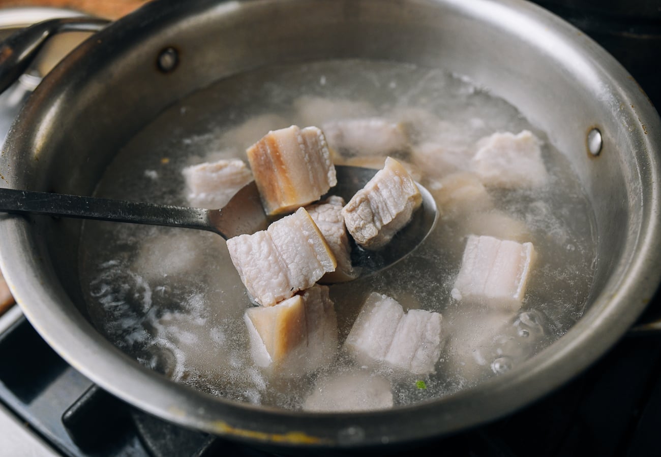 blanching pork belly pieces