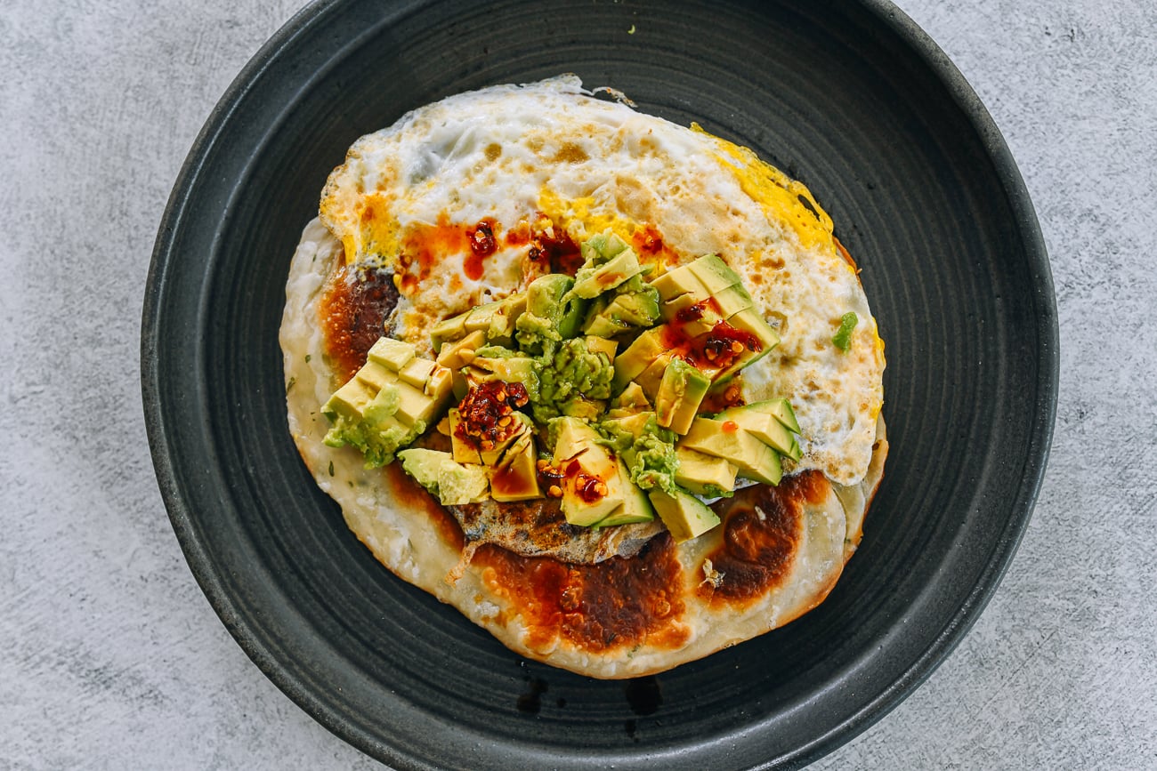 scallion pancake with egg and avocado and chili oil, soy sauce