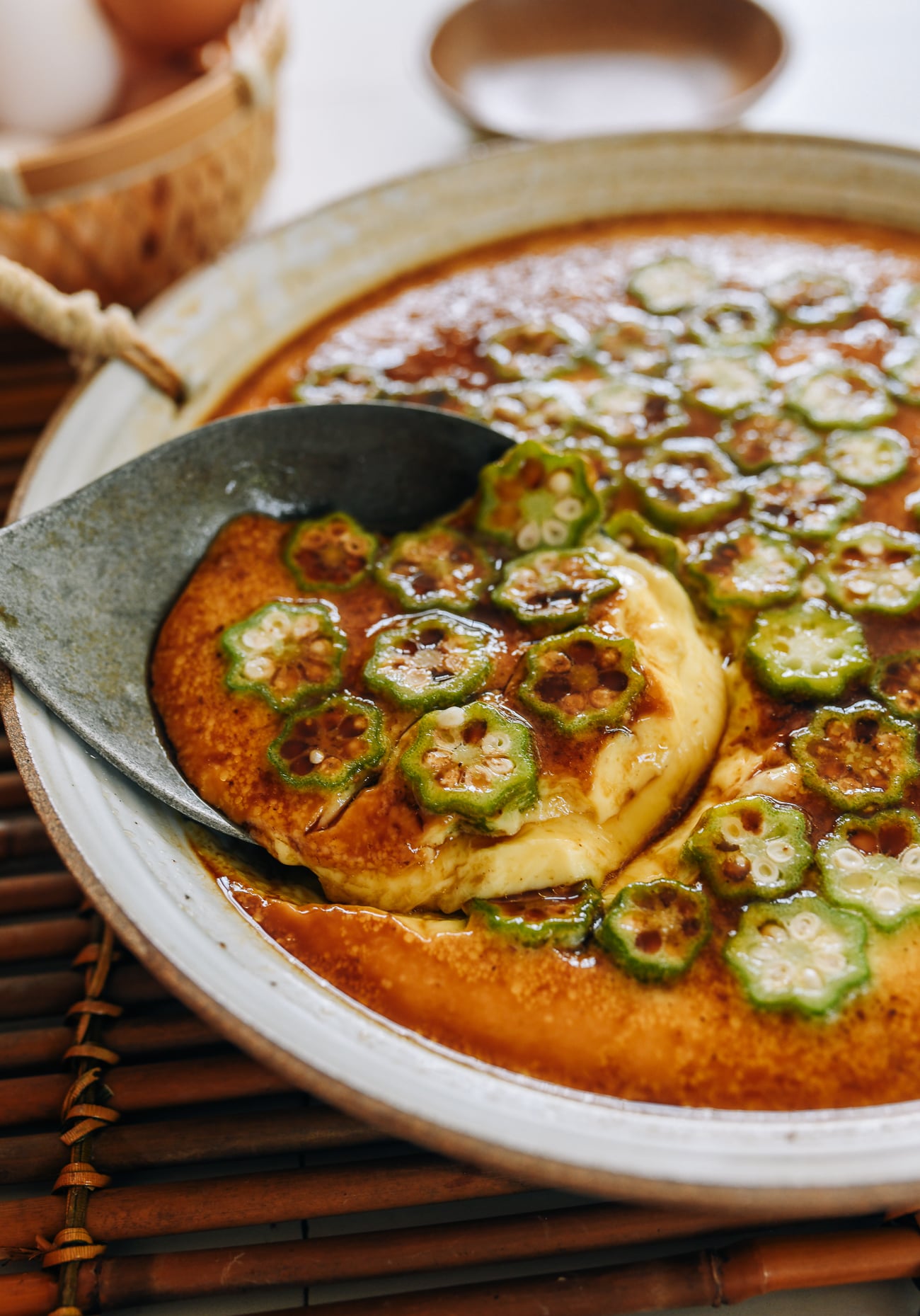 scooping steamed egg with okra