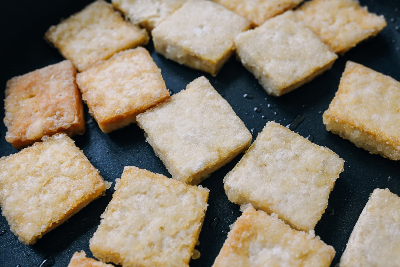 crispy coated tofu in nonstick pan