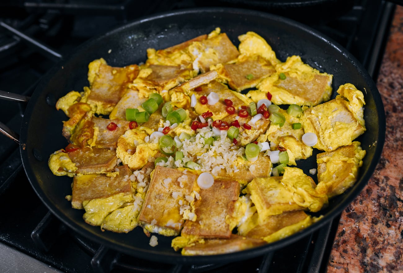 adding chili, garlic, scallion, with egg