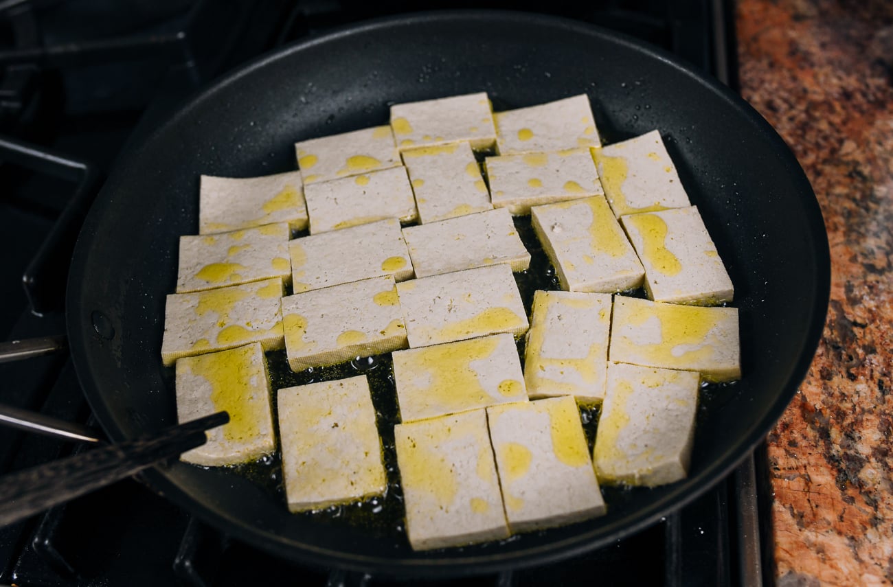 pan-frying sliced tofu in nonstick pan