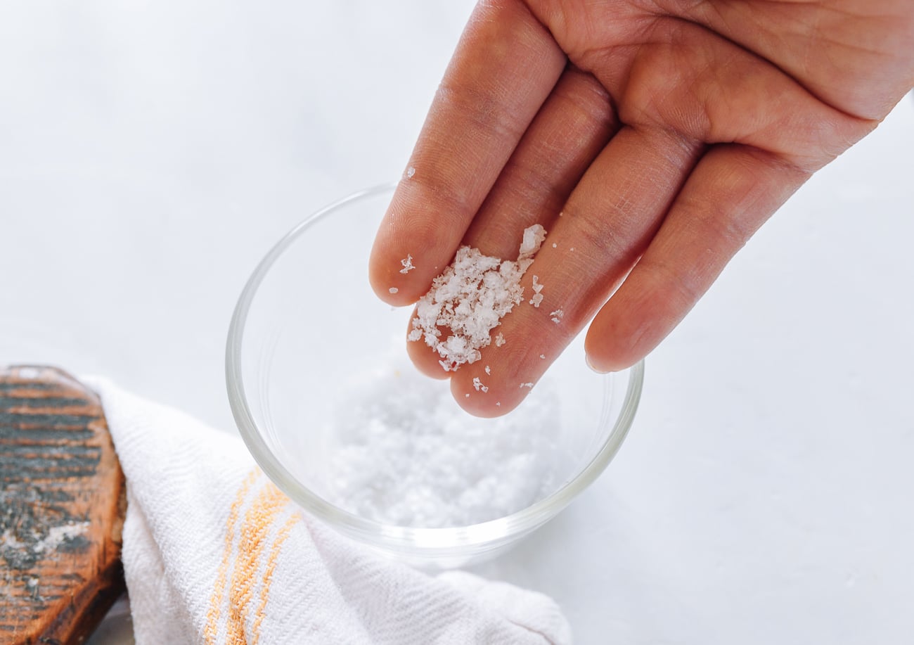 flaked salt in glass pinch bowl