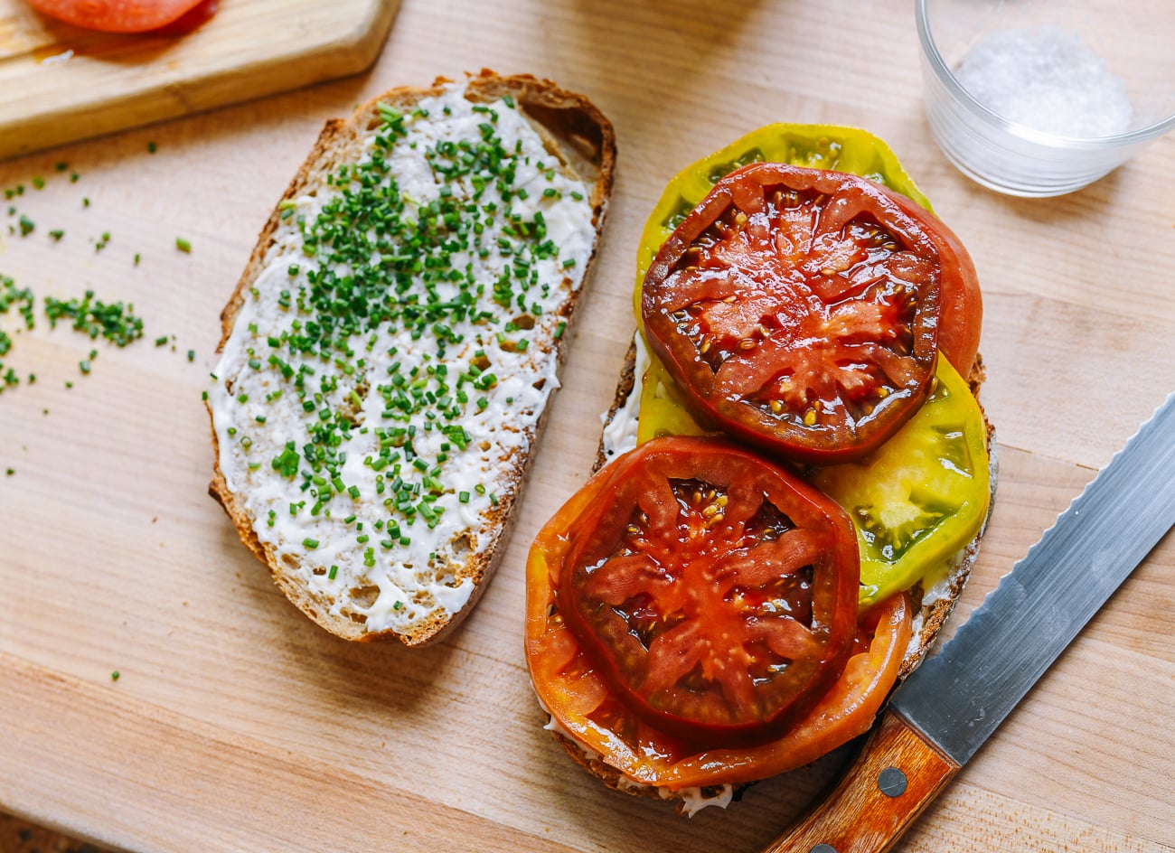Tomato slices on bread with mayonnaise and chives
