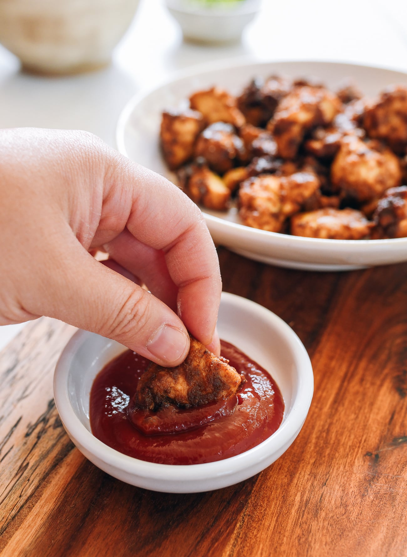 dipping air fryer tofu into ketchup
