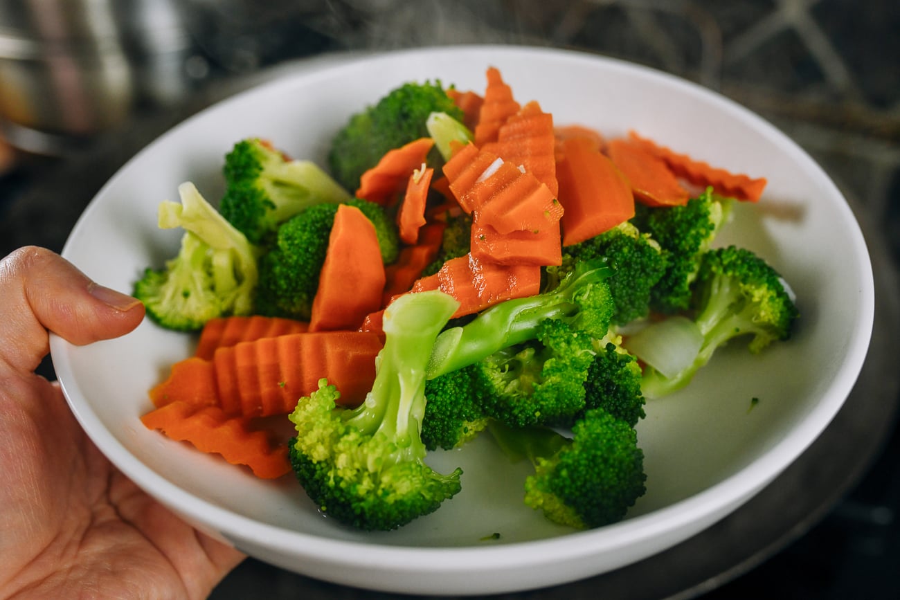 blanched carrots and broccoli in shallow bowl