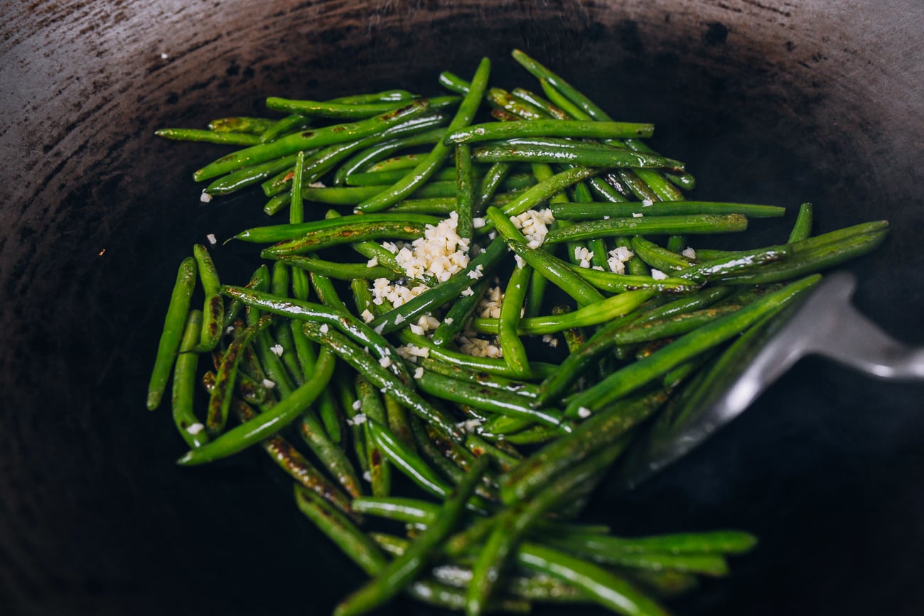 adding garlic to green beans