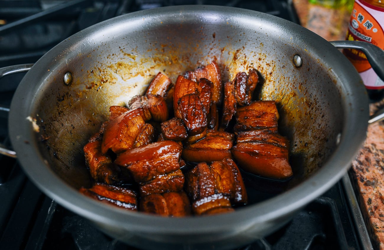 making braised pork belly in stainless steel pot