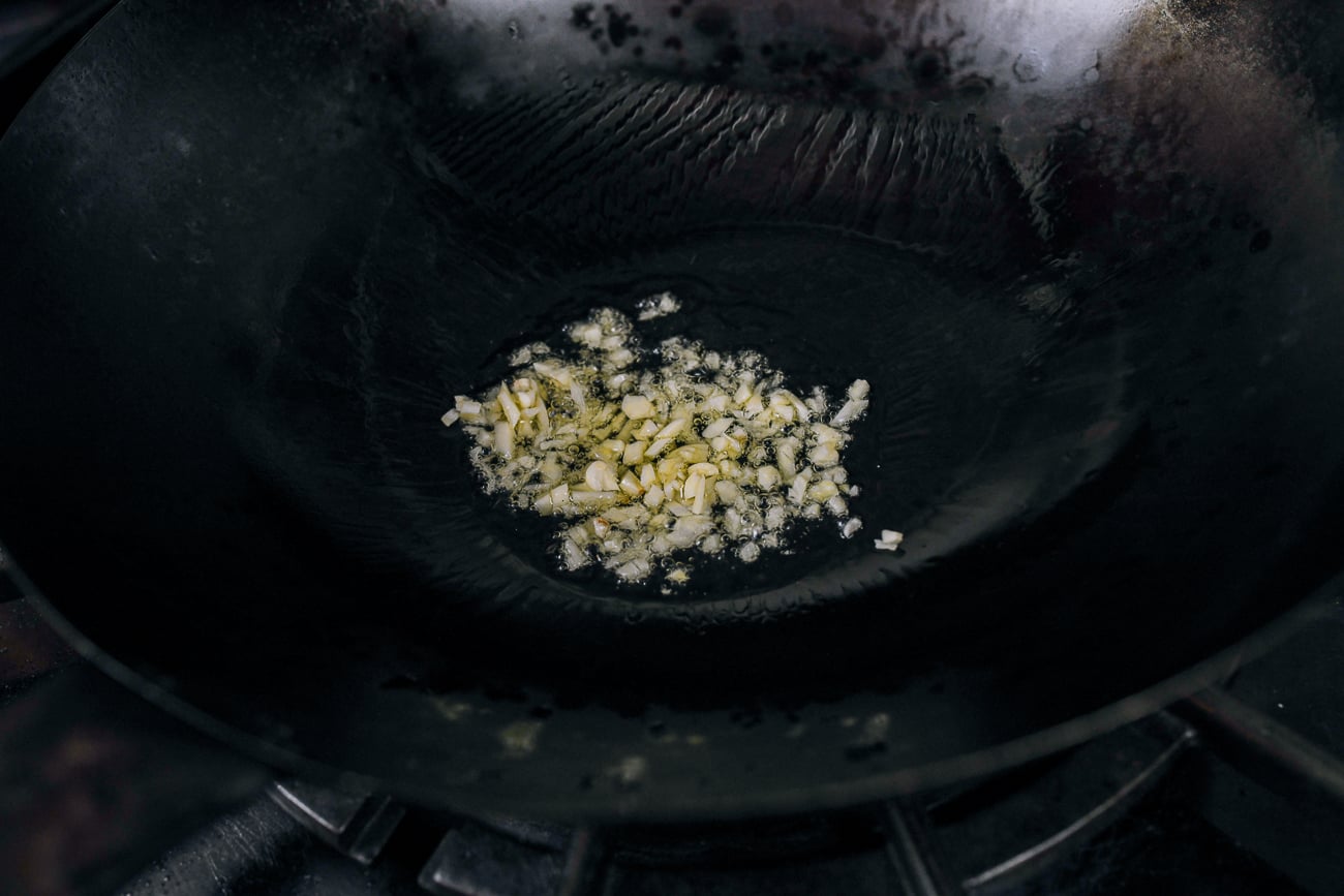 garlic in oil in wok