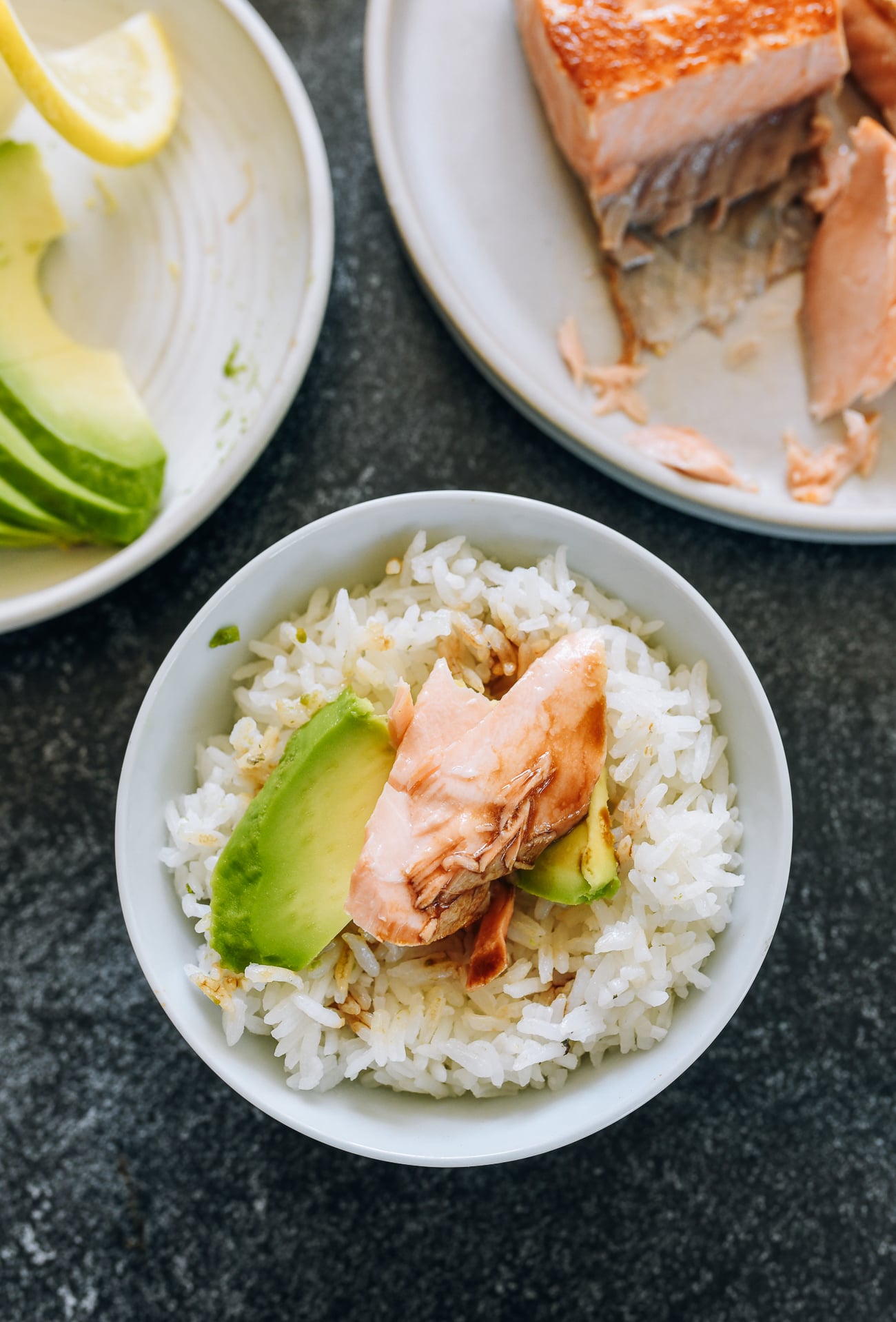 salmon and avocado with soy sauce over rice