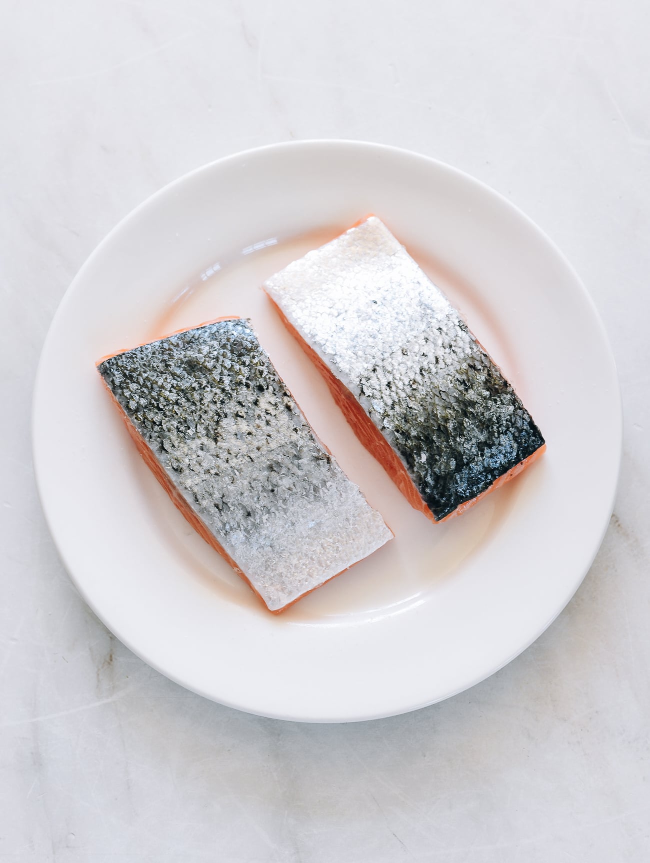 salmon filets skin-side up