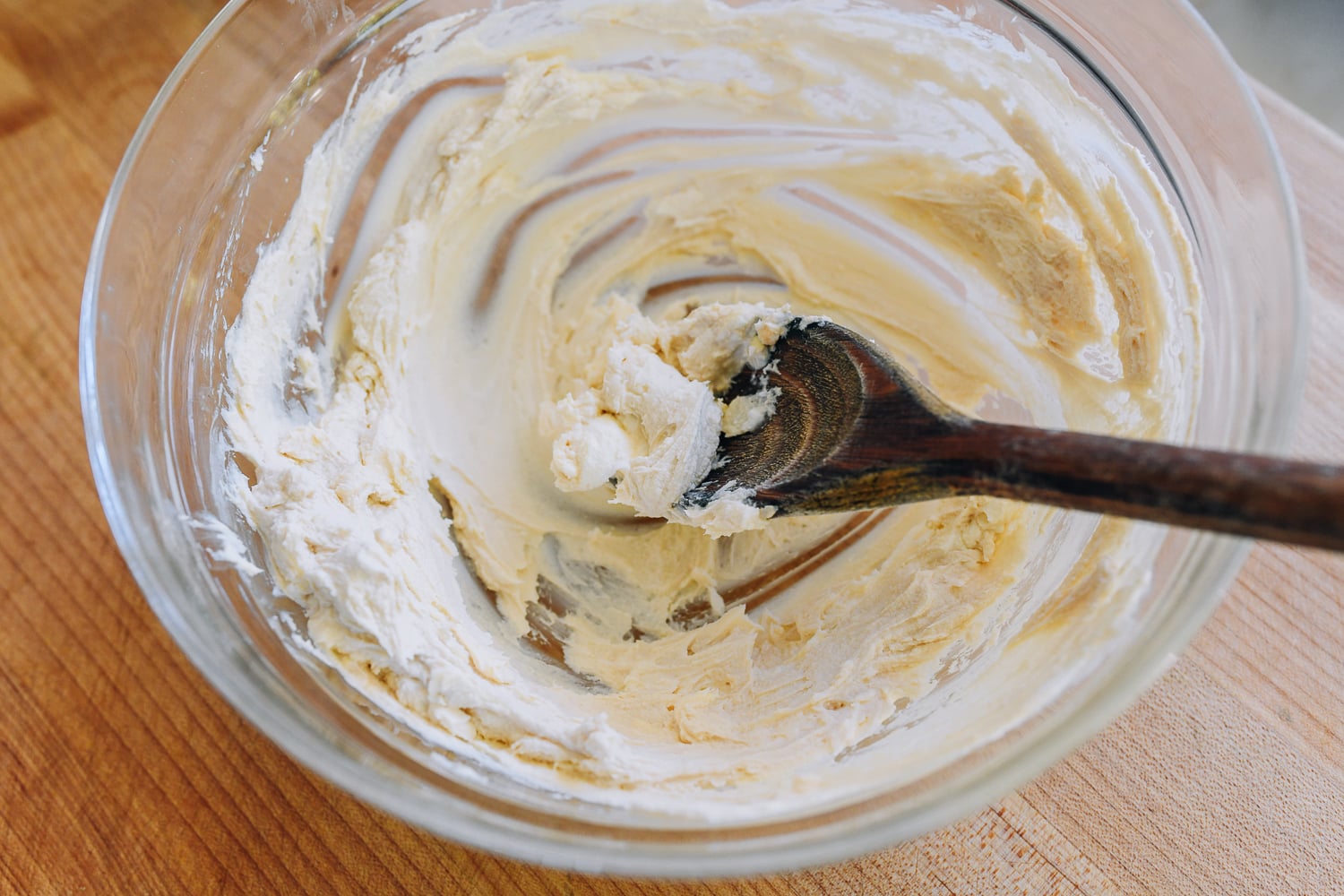 cream cheese and butter mixed in a glass bowl