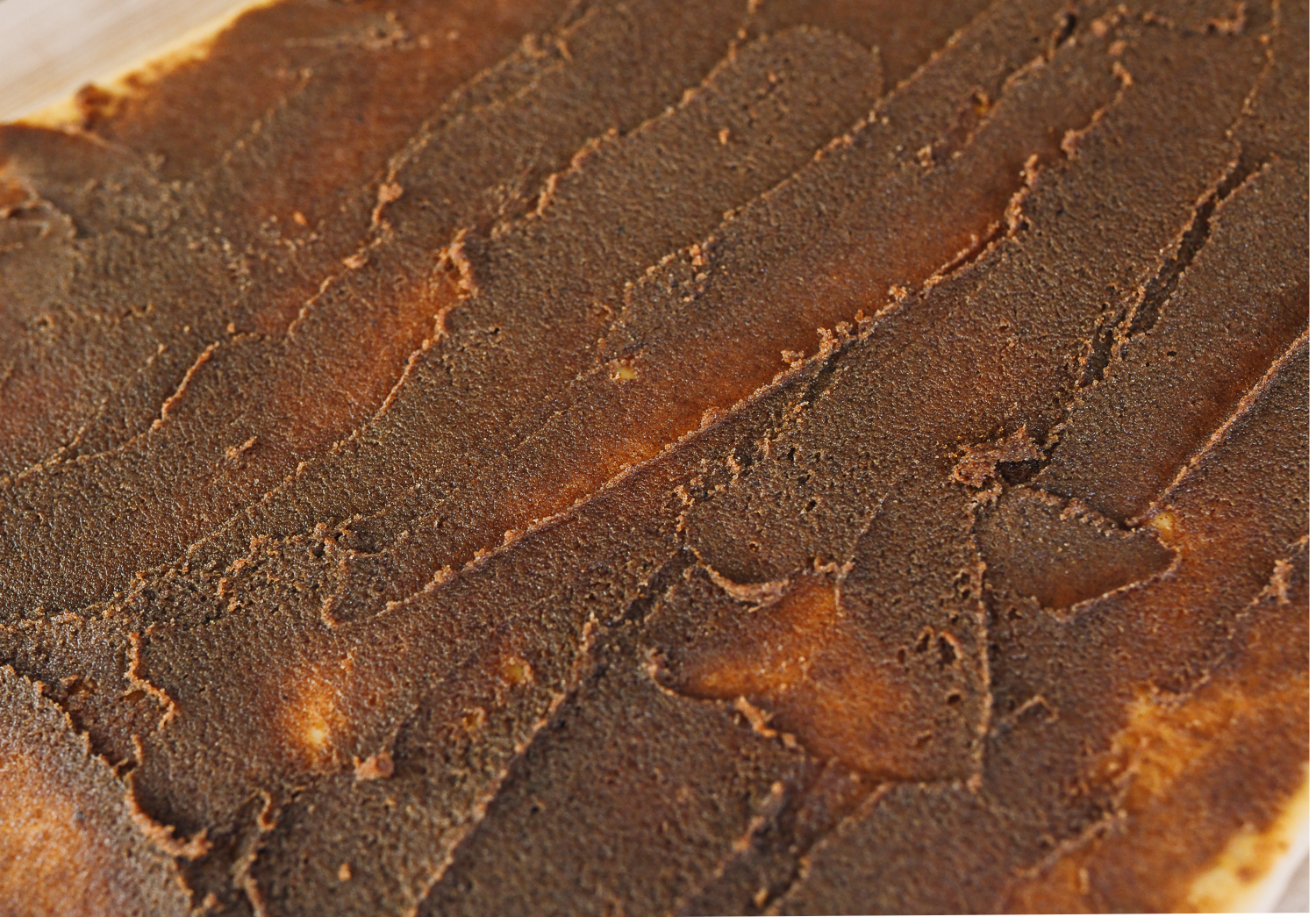 cinnamon roll filling spread out on dough