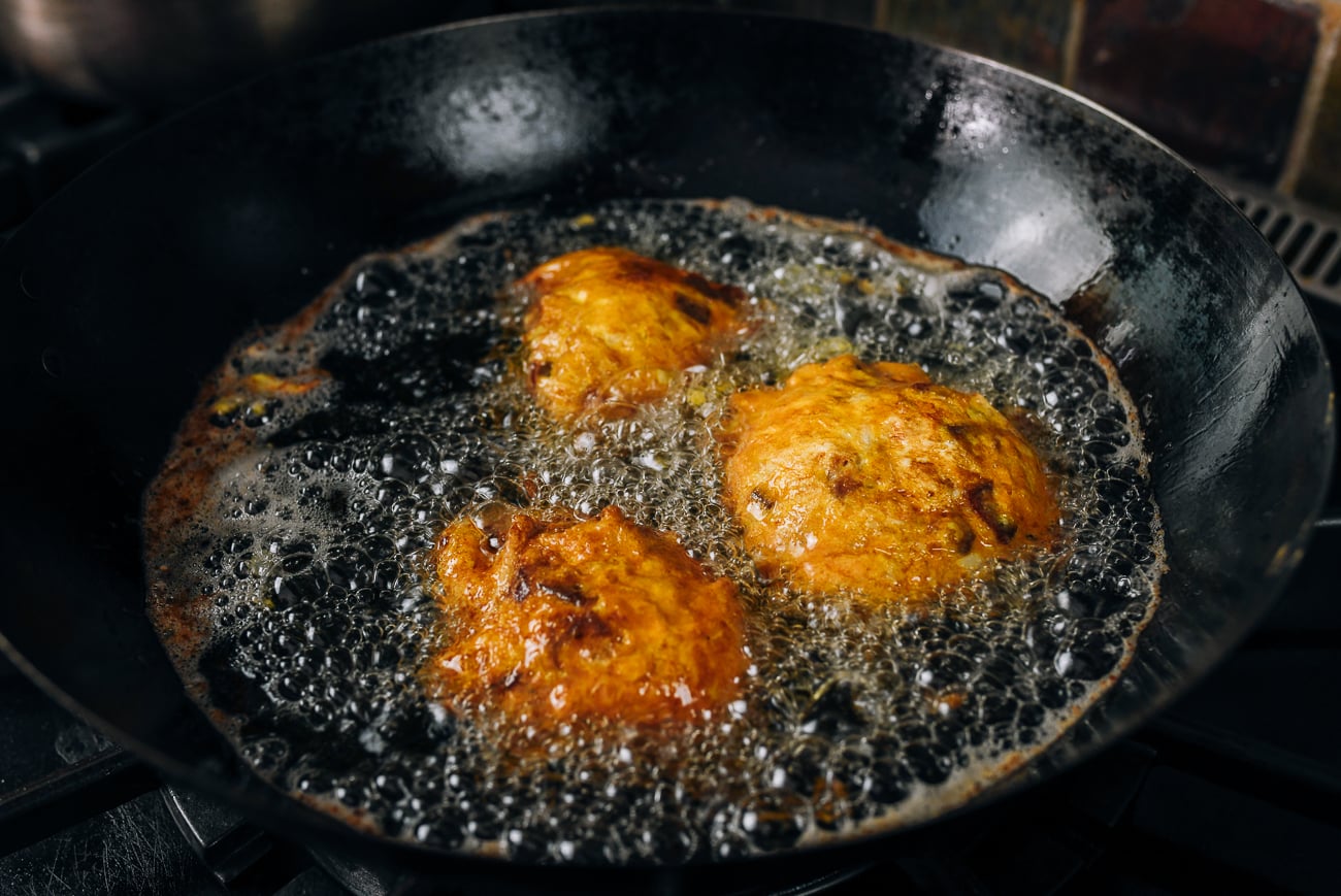 flipped egg foo young patties in oil