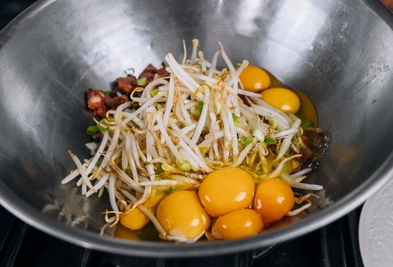 pork egg foo young mixture with bean sprouts, onions, eggs