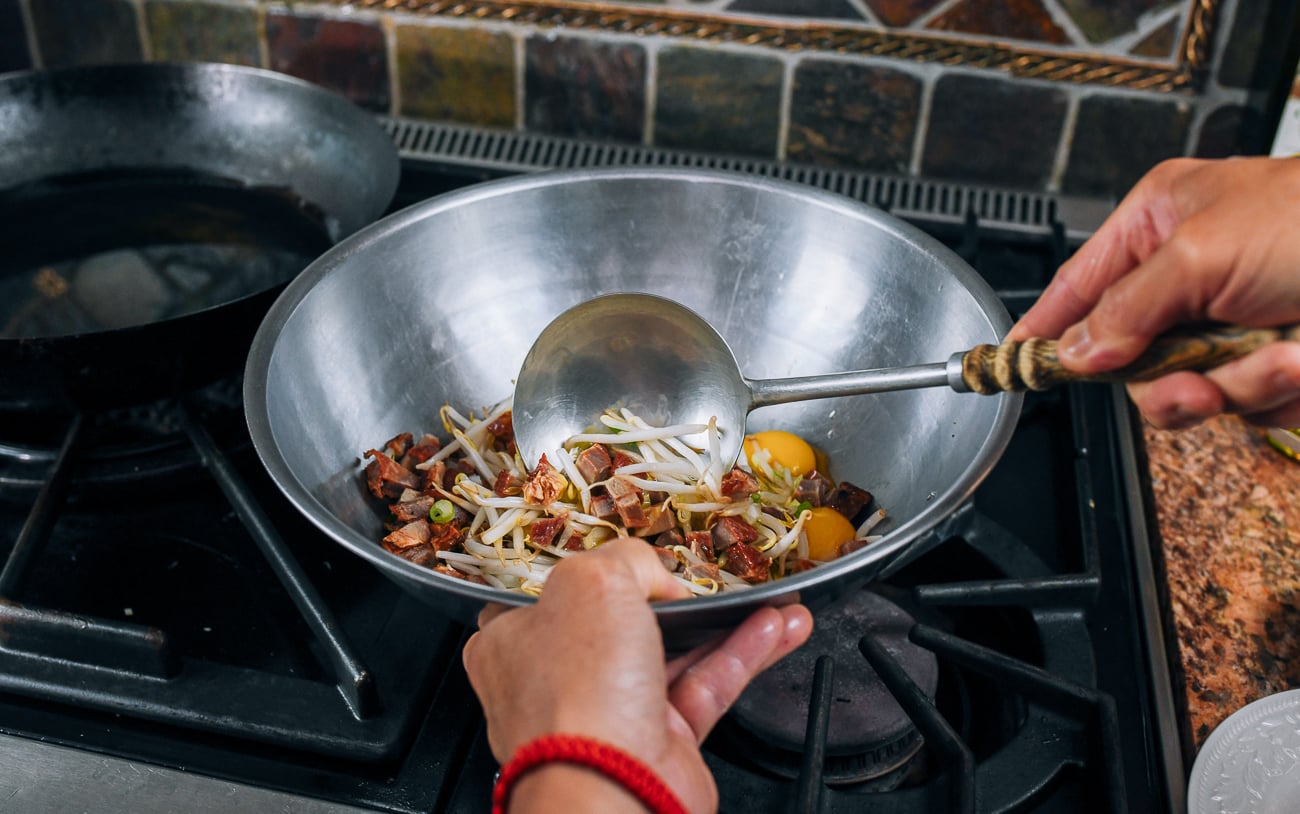 mixing pork egg foo young batter