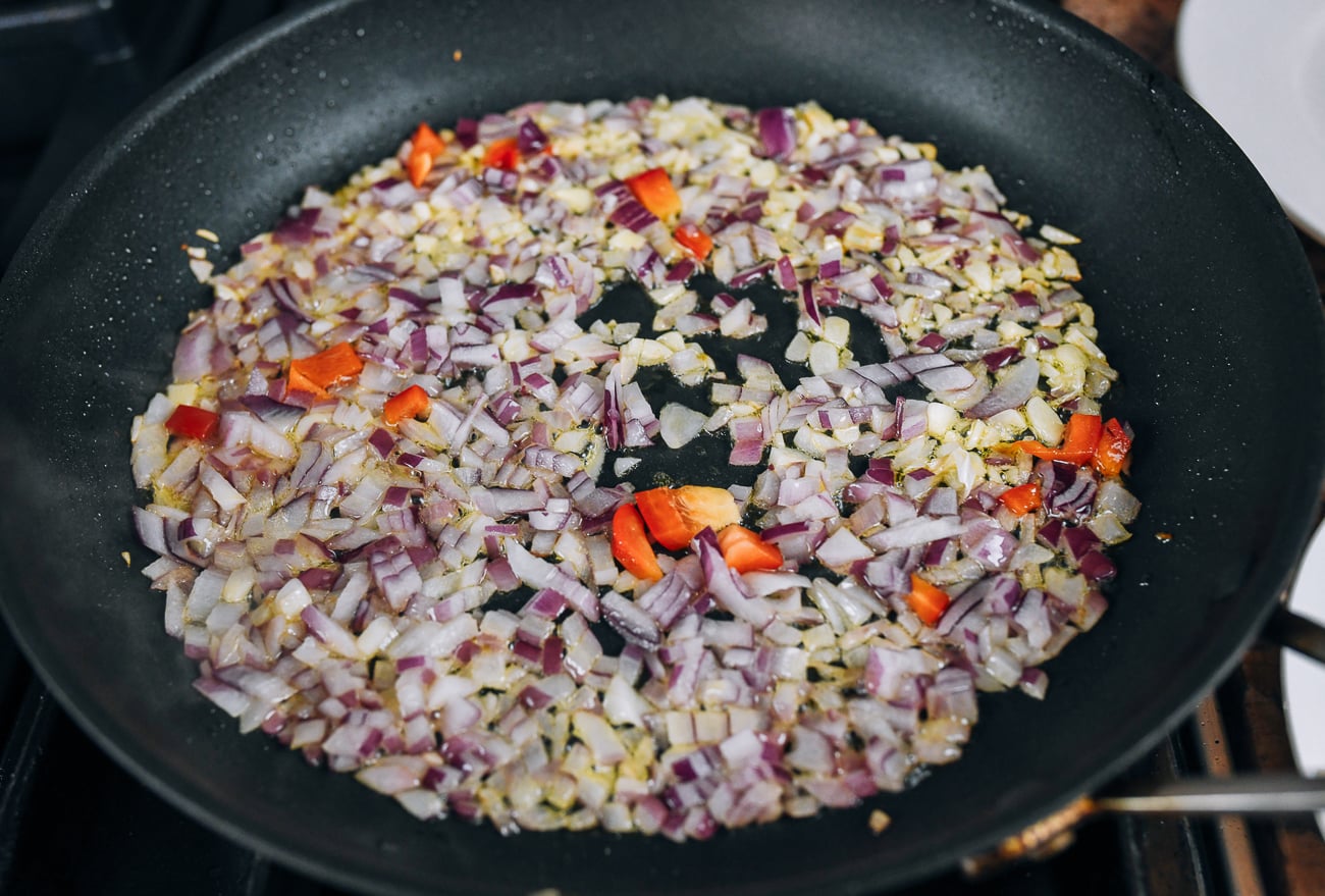 onions and garlic cooking in pan