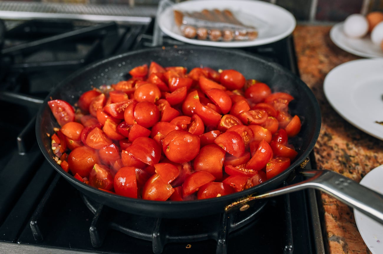 tomato halves added to pan