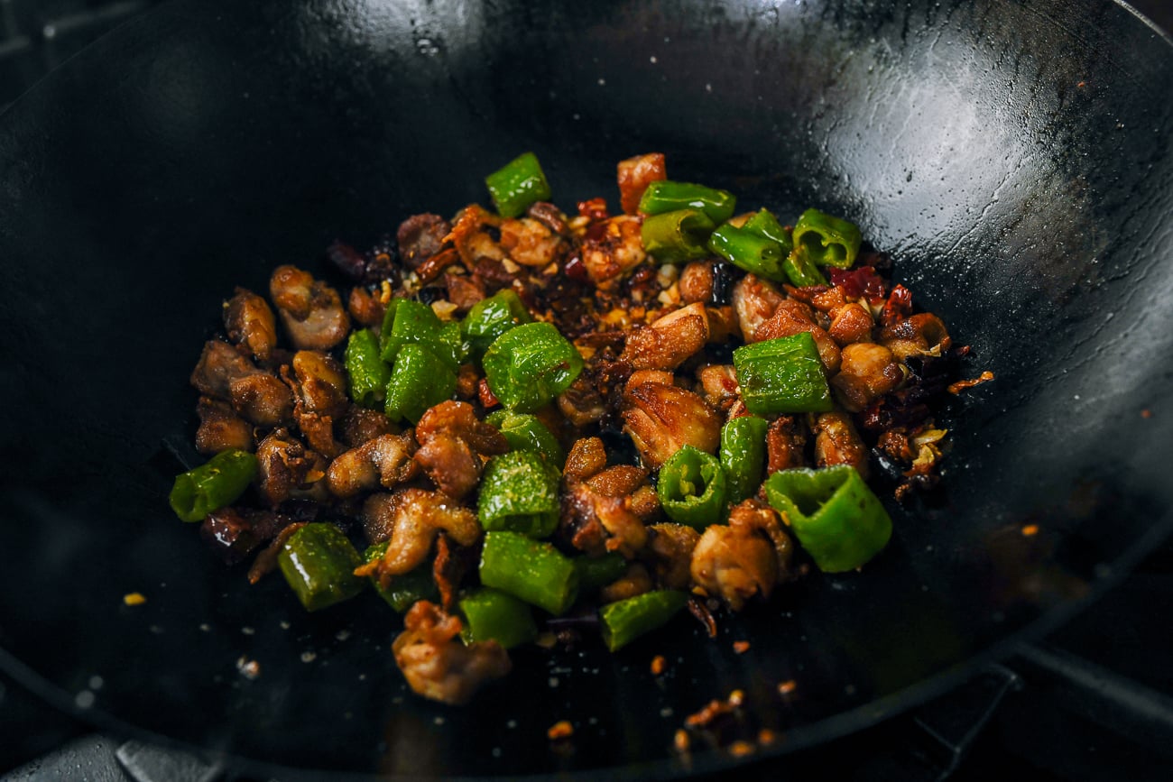 cooking Sichuan three pepper chicken in wok